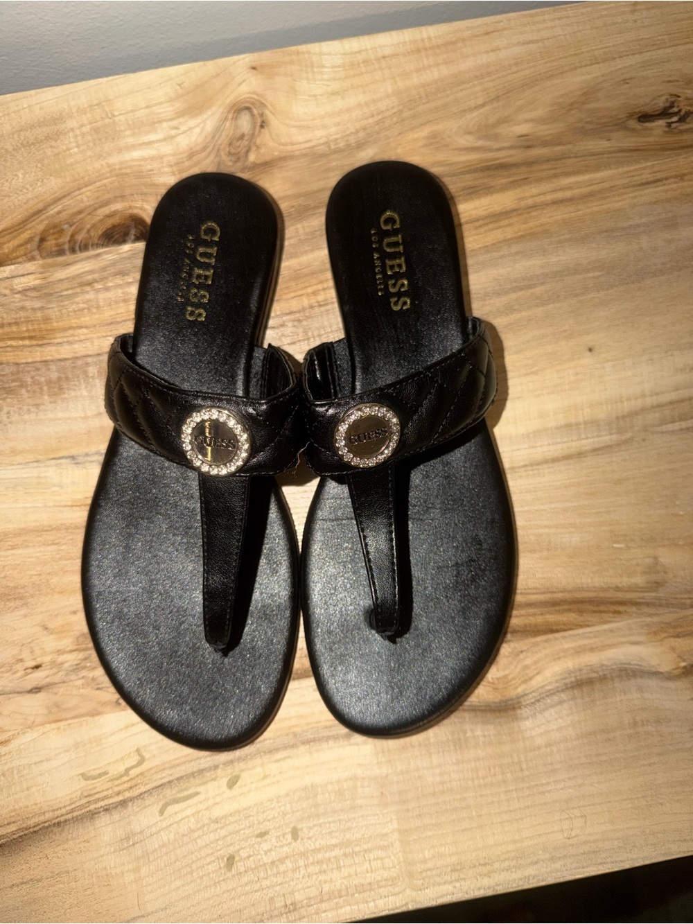 GUESS Black Quilted Thong Sandals with Gold Logo Medallions